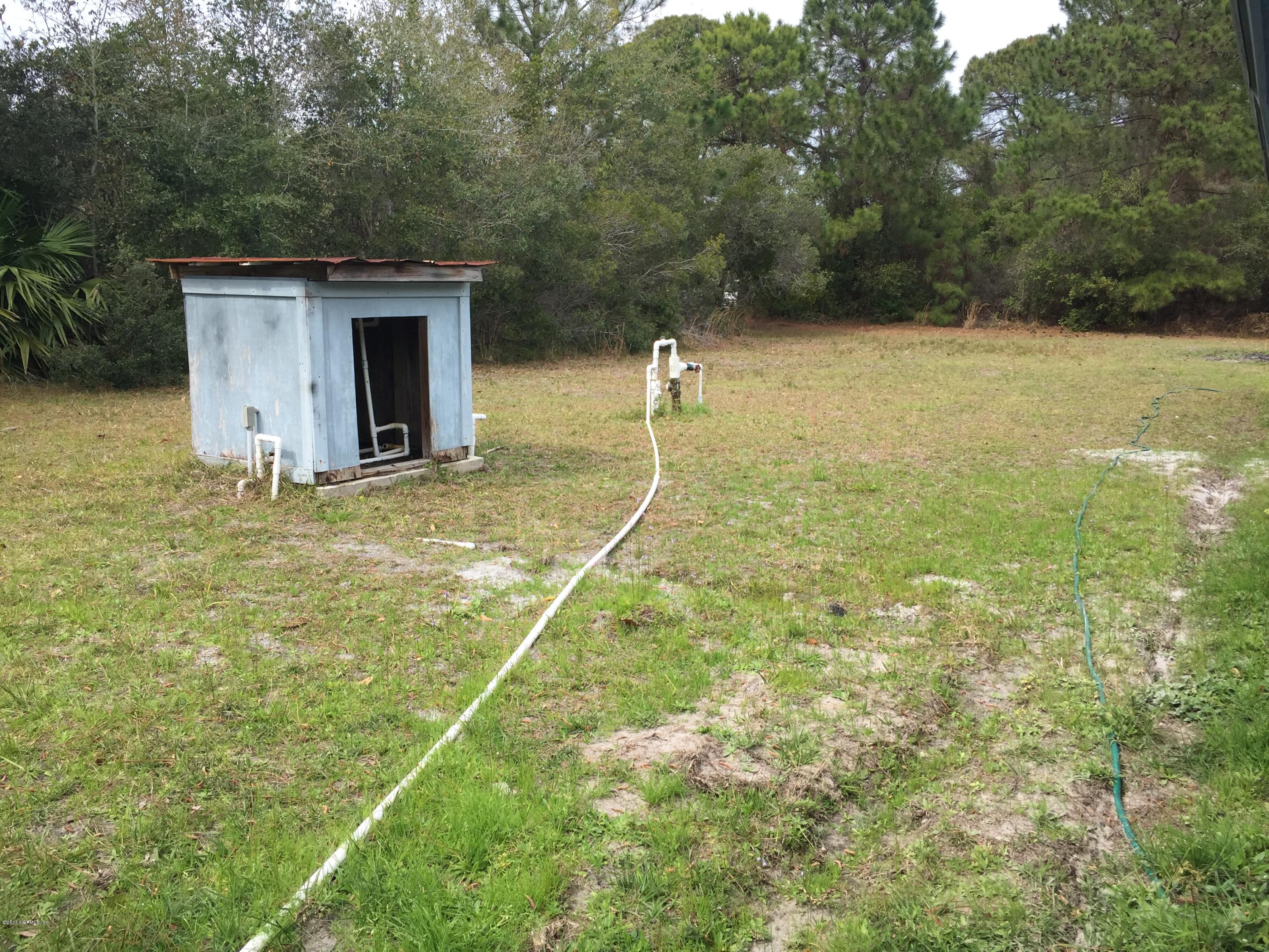 10400 Sawpit Road Jacksonville, FL 32226 - Photo 17 of 30 a backyard of a house with lots of green space