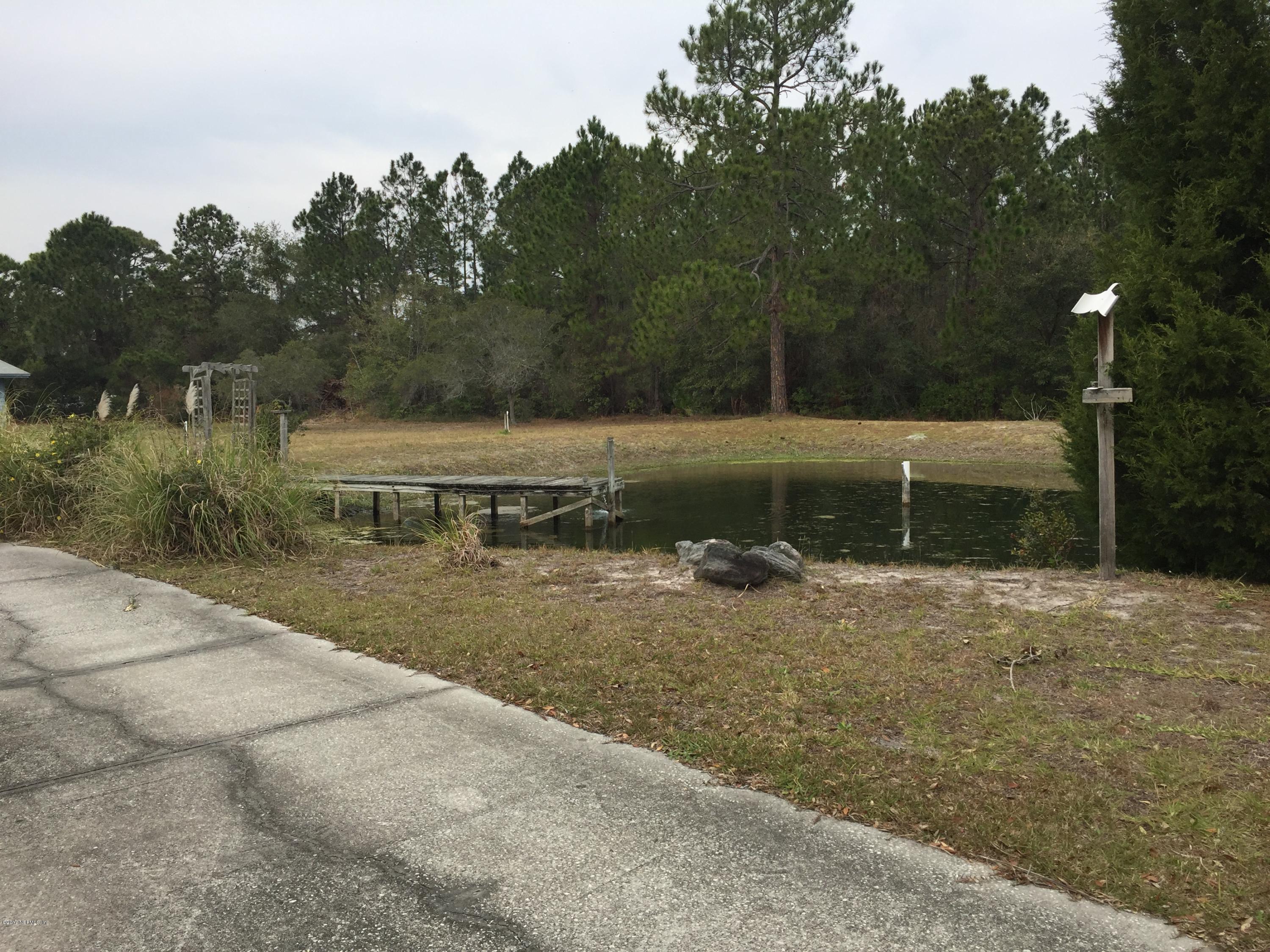 10400 Sawpit Road Jacksonville, FL 32226 - Photo 19 of 30 a view of a backyard with a lake view