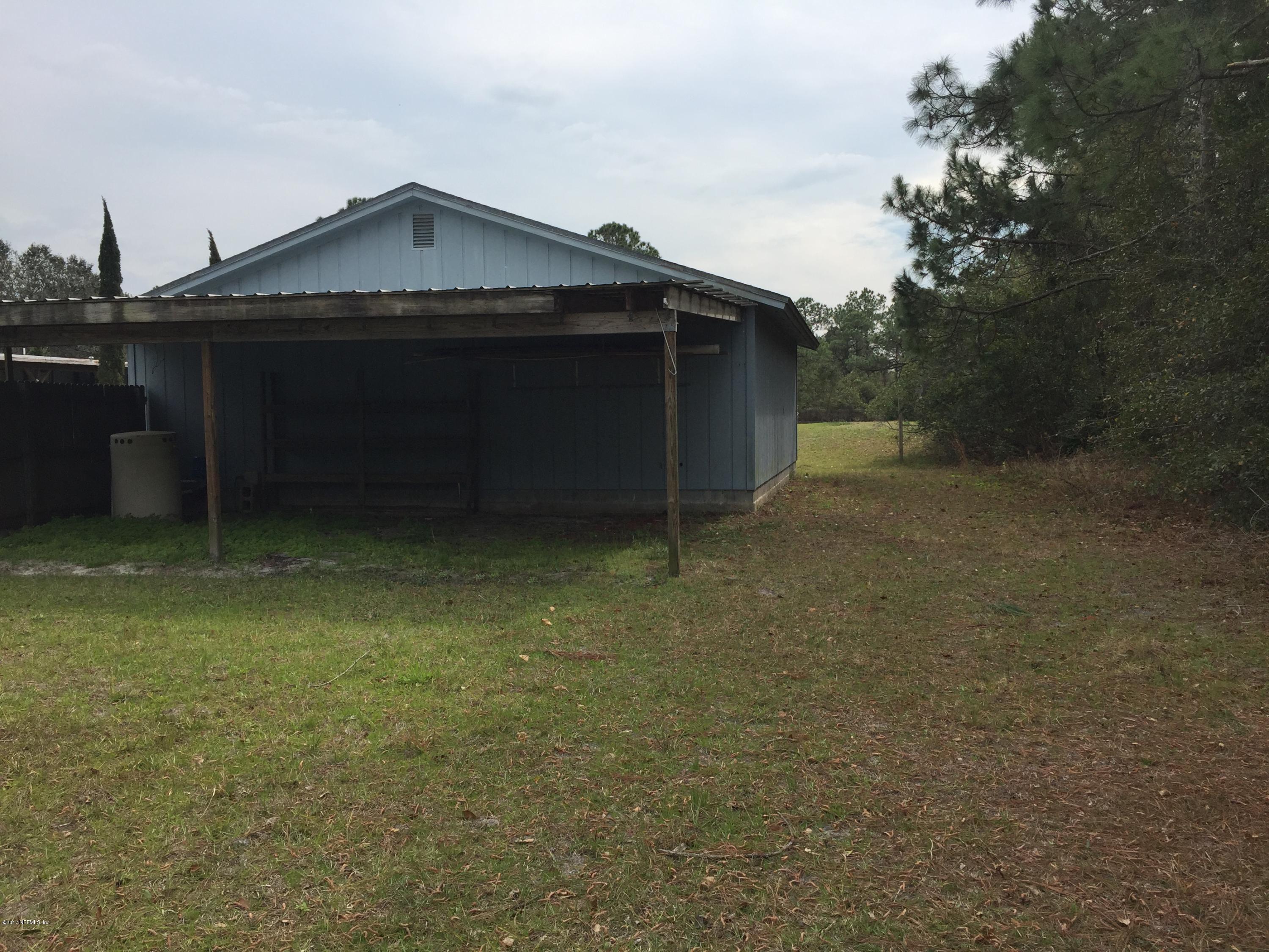 10400 Sawpit Road Jacksonville, FL 32226 - Photo 21 of 30 a view of a house with a yard