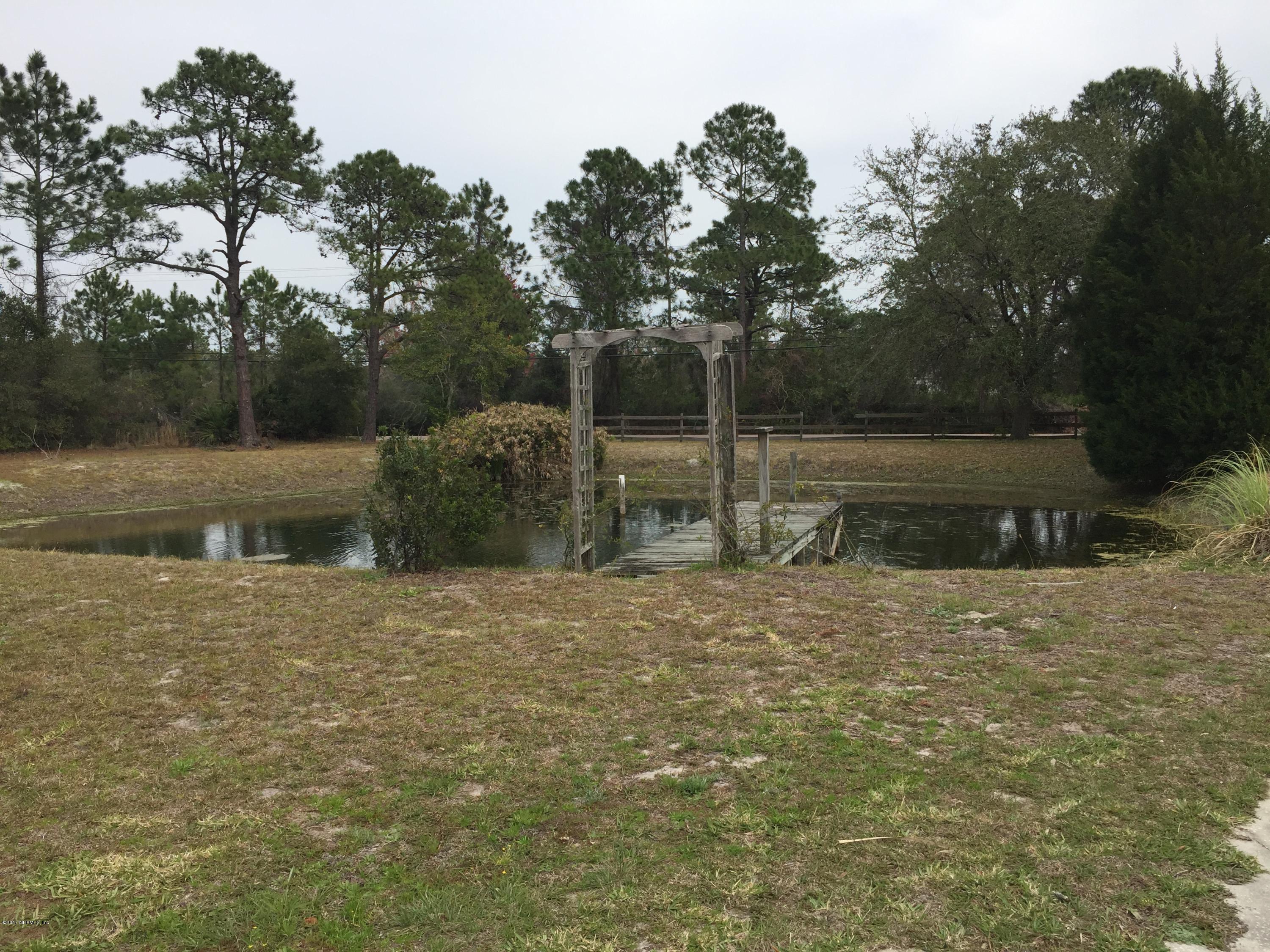 10400 Sawpit Road Jacksonville, FL 32226 - Photo 5 of 30 a backyard of a house with lots of green space