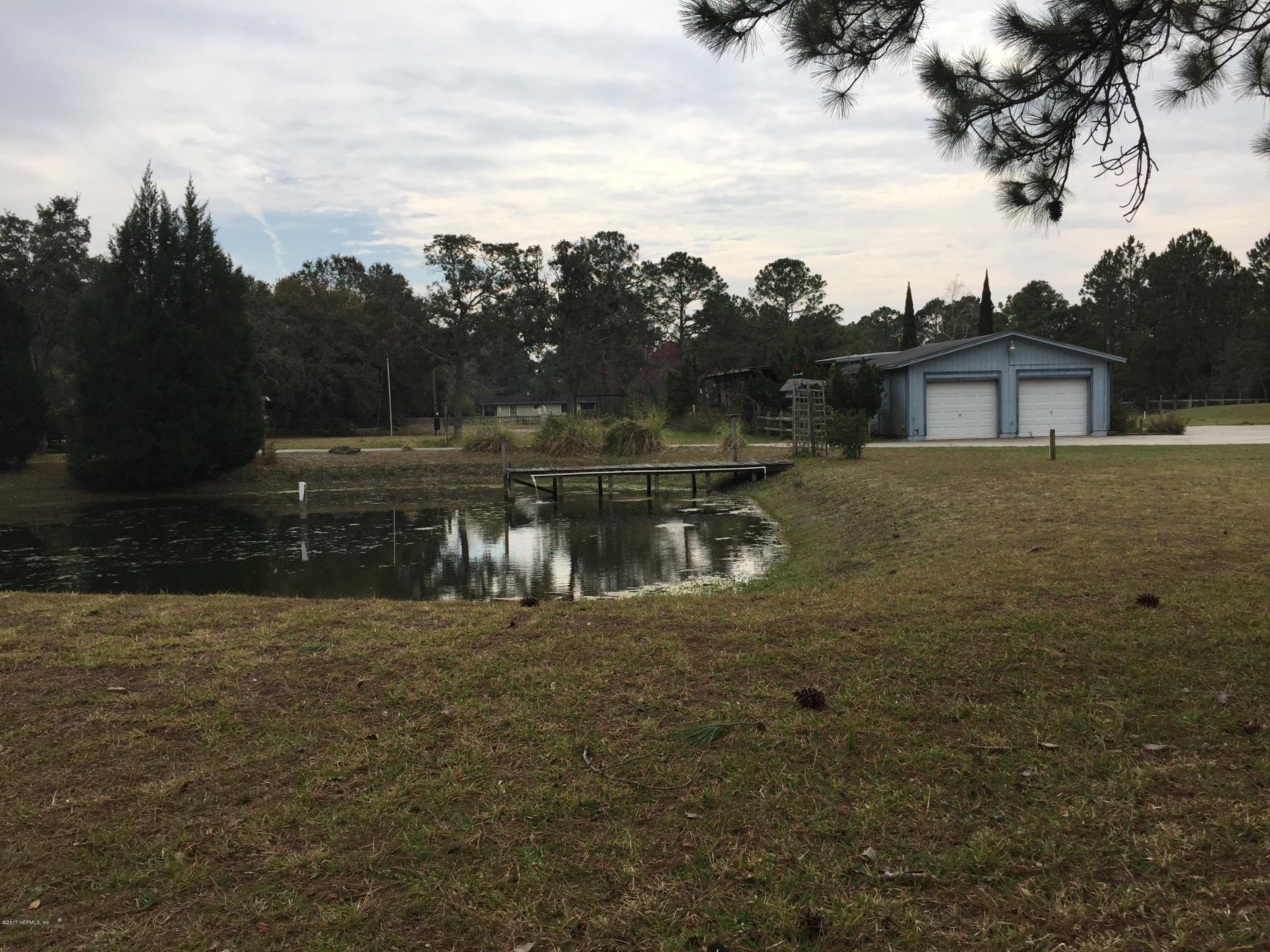 10400 Sawpit Road Jacksonville, FL 32226 - Photo 10 of 30 a view of a house with a yard