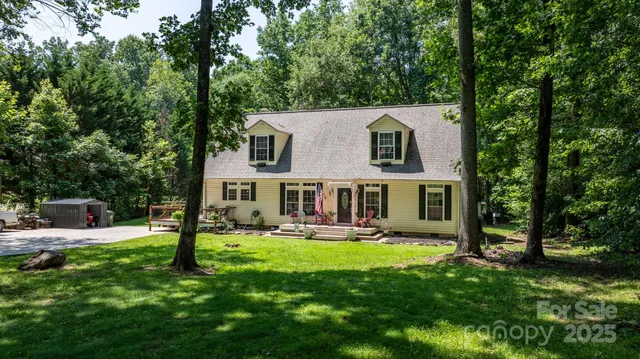 a view of a house with a yard porch and sitting area
