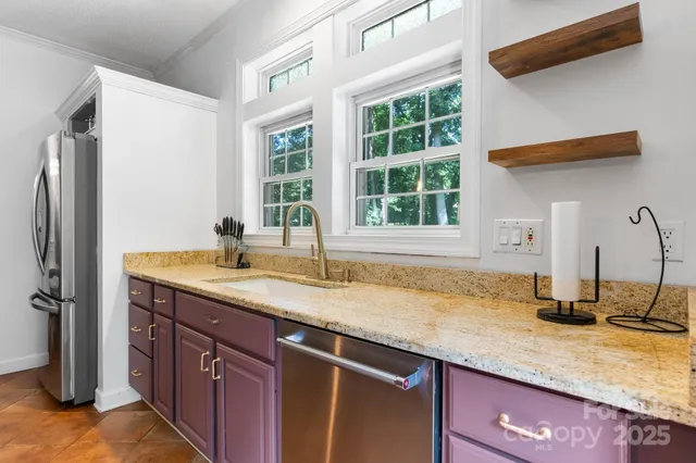 a kitchen with a sink and a refrigerator