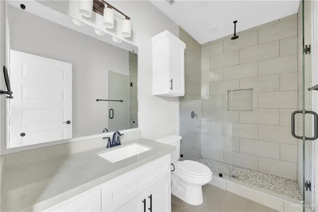 an empty room with a window and a ceiling fan