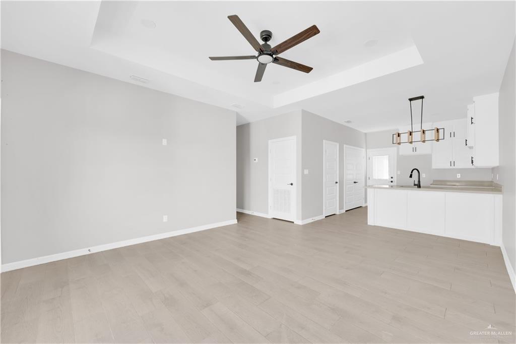 913 West 13th Street, Unit 2 San Juan, TX 78589 - Photo 3 of 14 a view of a kitchen with a sink and cabinets