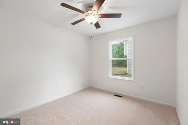 a view of a bathroom from a hallway