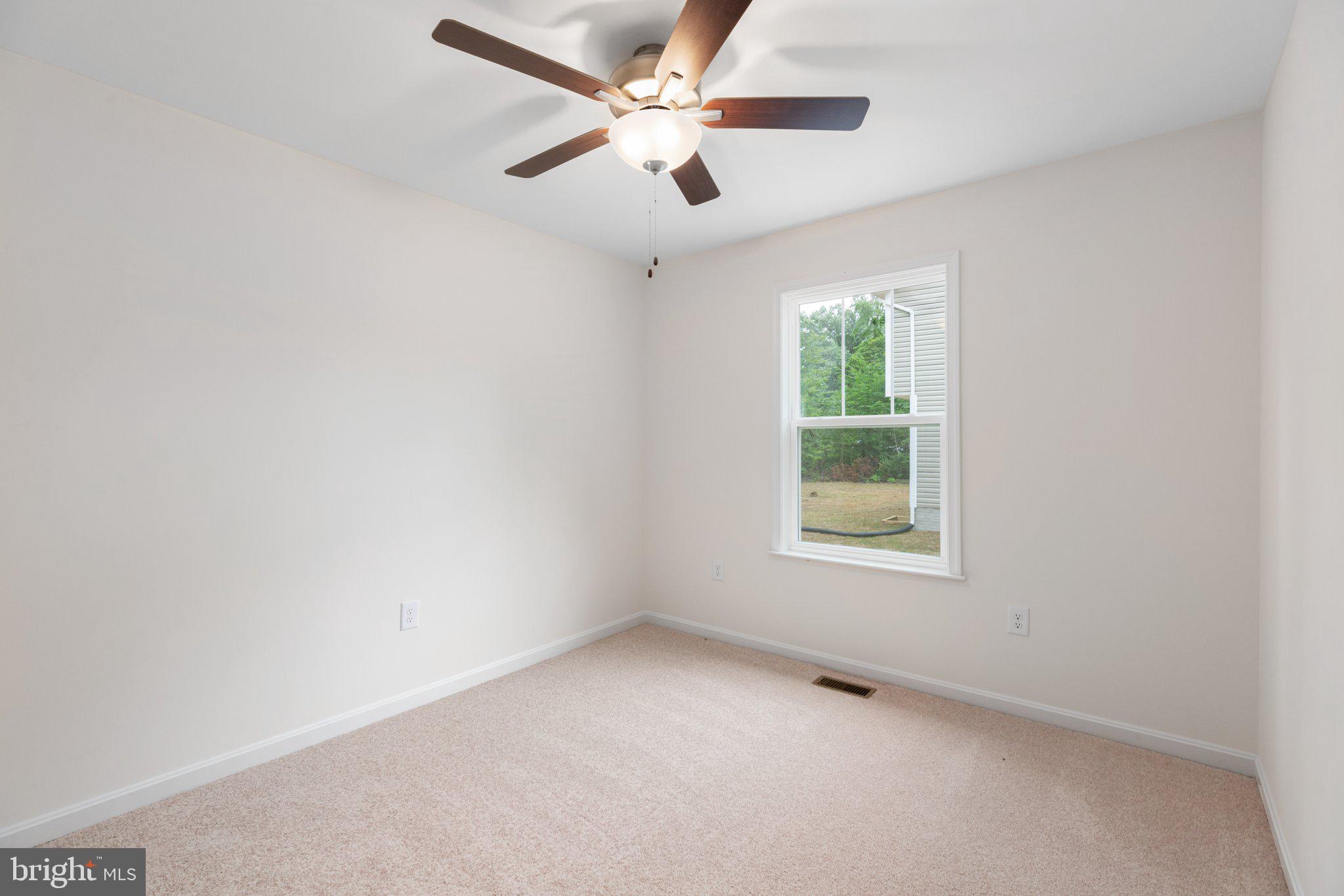 2 Ferry Landing Colonial Beach, VA 22443 - Photo 26 of 62 an empty room with a window and a fan