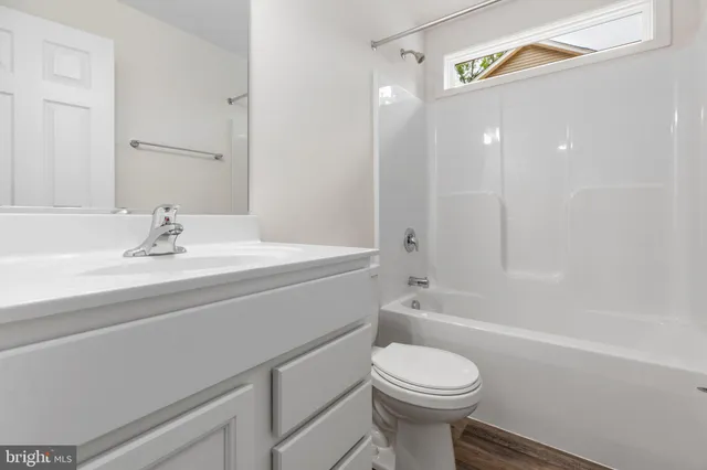 a kitchen with a refrigerator a stove a microwave and a counter top space