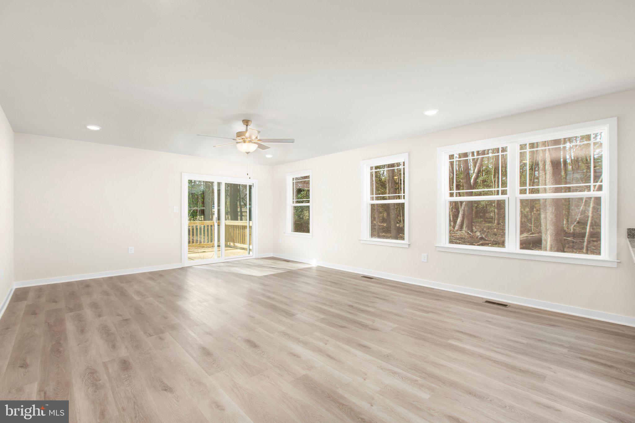 2 Ferry Landing Colonial Beach, VA 22443 - Photo 40 of 62 a view of an empty room with a window and wooden floor