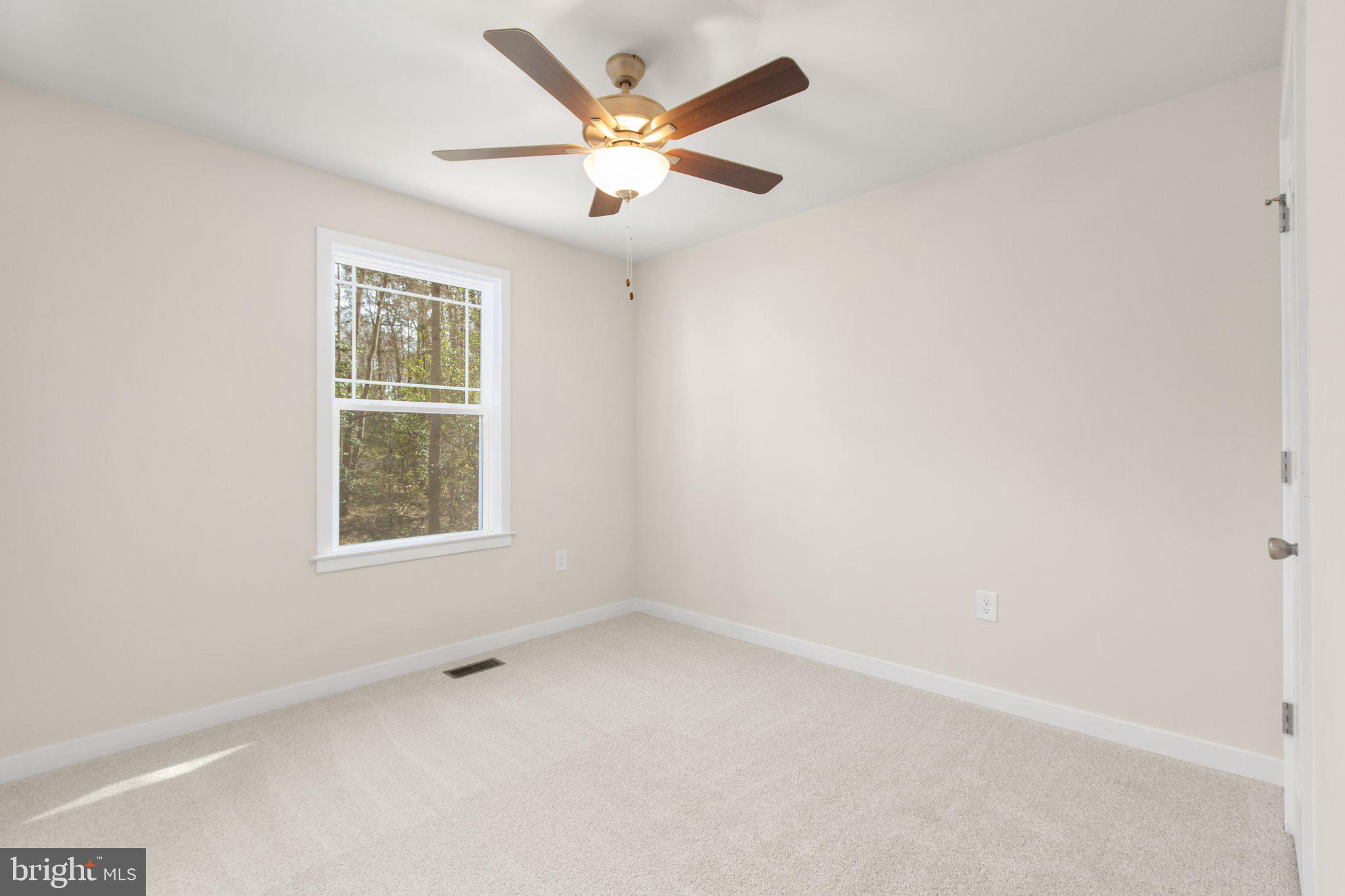 2 Ferry Landing Colonial Beach, VA 22443 - Photo 50 of 62 an empty room with a window and a ceiling fan