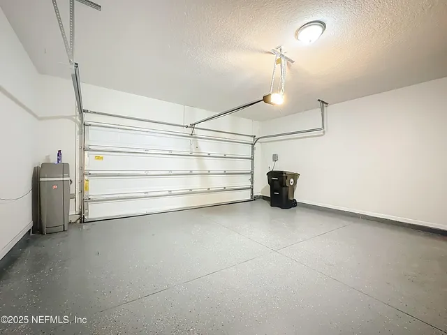 a view of a store room cabinets and a ceiling fan
