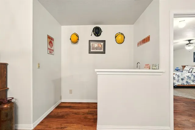a view of door with wooden floor