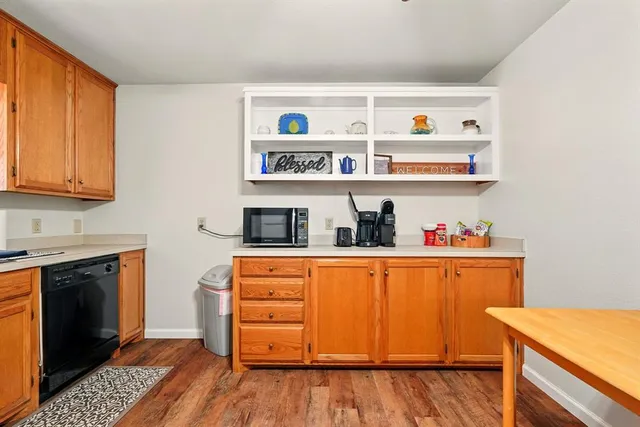 a kitchen with stainless steel appliances granite countertop a stove and a refrigerator