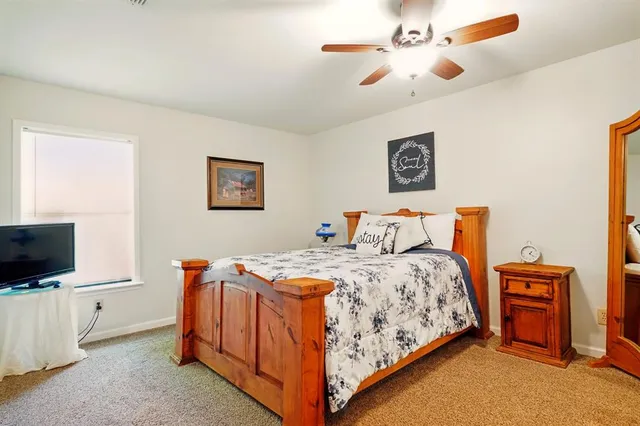 a bedroom with bed and tv