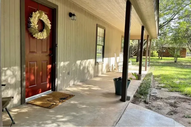 a view of a back yard of the house