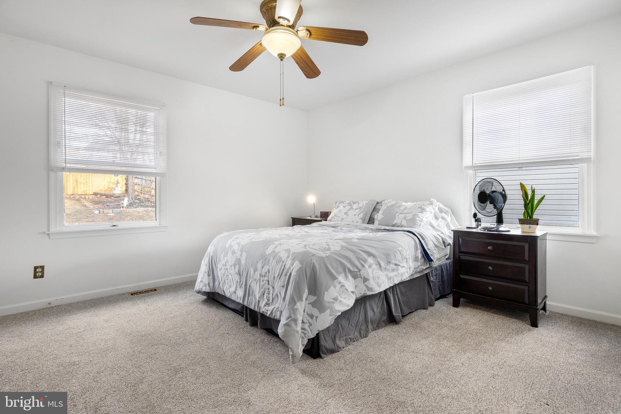 303 Gray Mt Circle Elkton, MD 21921 - Photo 20 of 35 a spacious bedroom with a bed and a window