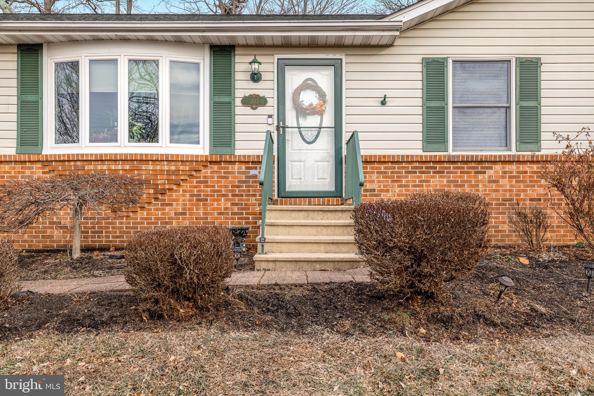 303 Gray Mt Circle Elkton, MD 21921 - Photo 2 of 35 a front view of a house with garden