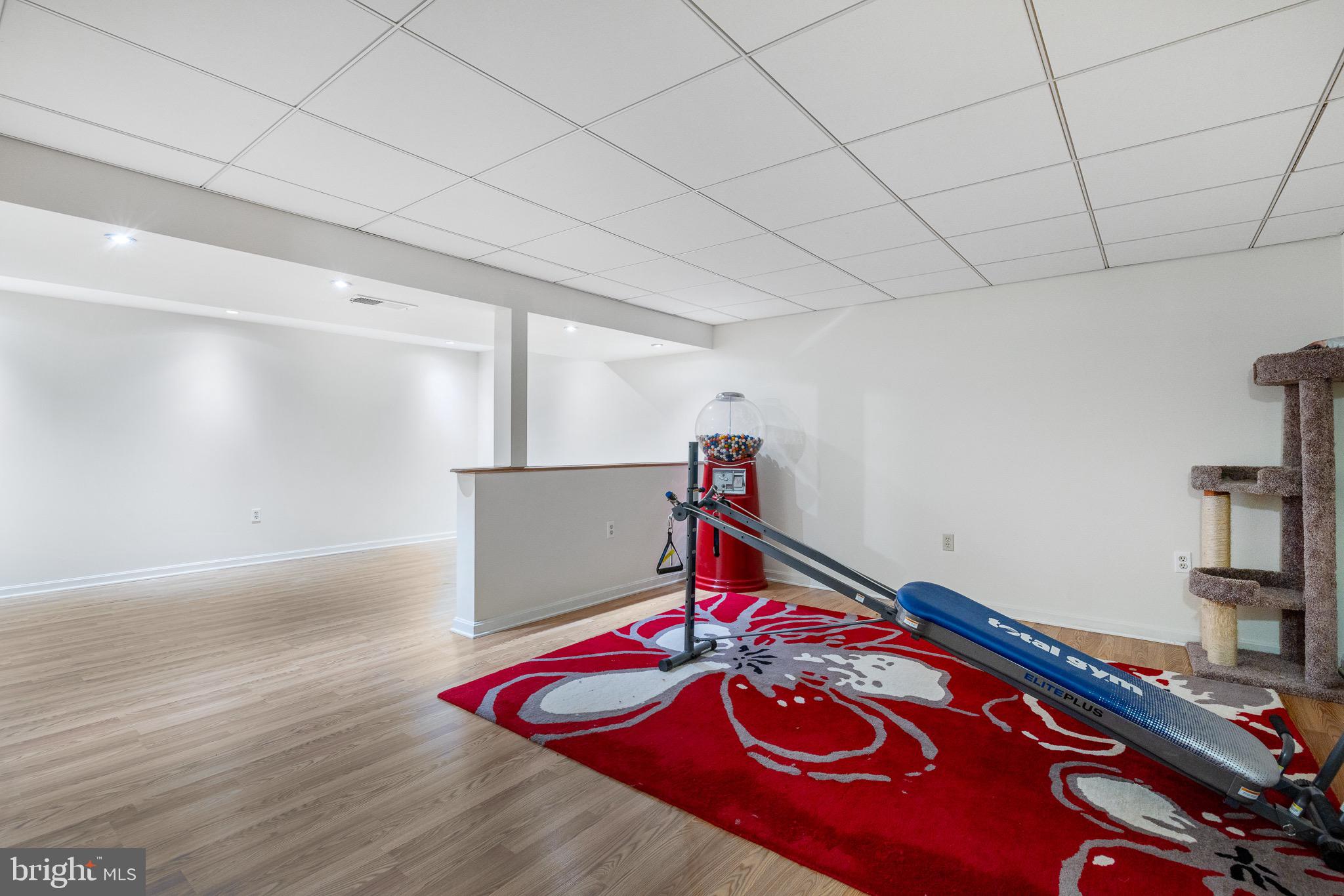 303 Gray Mt Circle Elkton, MD 21921 - Photo 27 of 35 a room with gym equipment and wooden floor