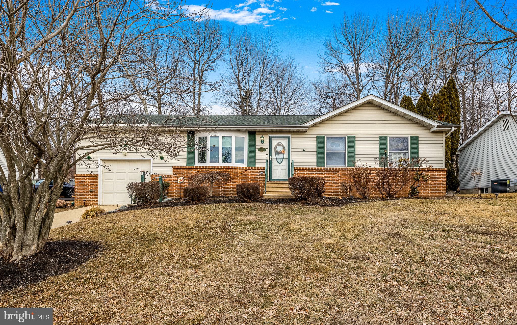303 Gray Mt Circle Elkton, MD 21921 - Photo 4 of 35 a front view of a house with a yard covered in snow