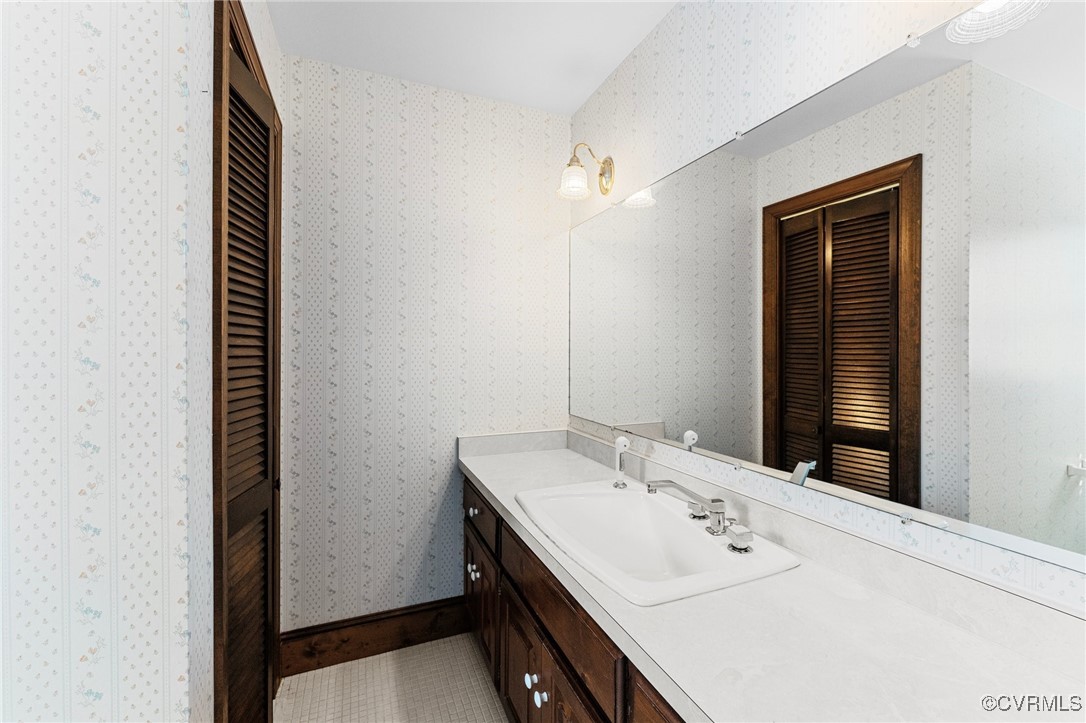 12001 Genito Road Midlothian, VA 23112 - Photo 36 of 49 a bathroom with a sink and a mirror