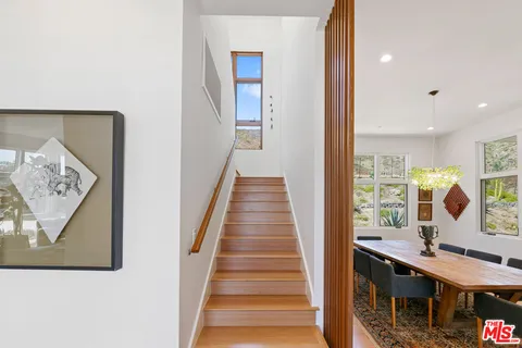 a bathroom with a window and a shower