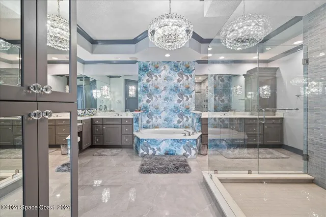 a utility room with cabinets washer and dryer