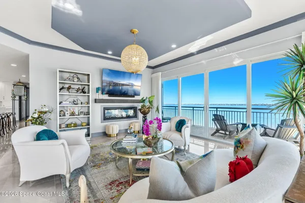 a view of a swimming pool with a lounge chairs in the patio