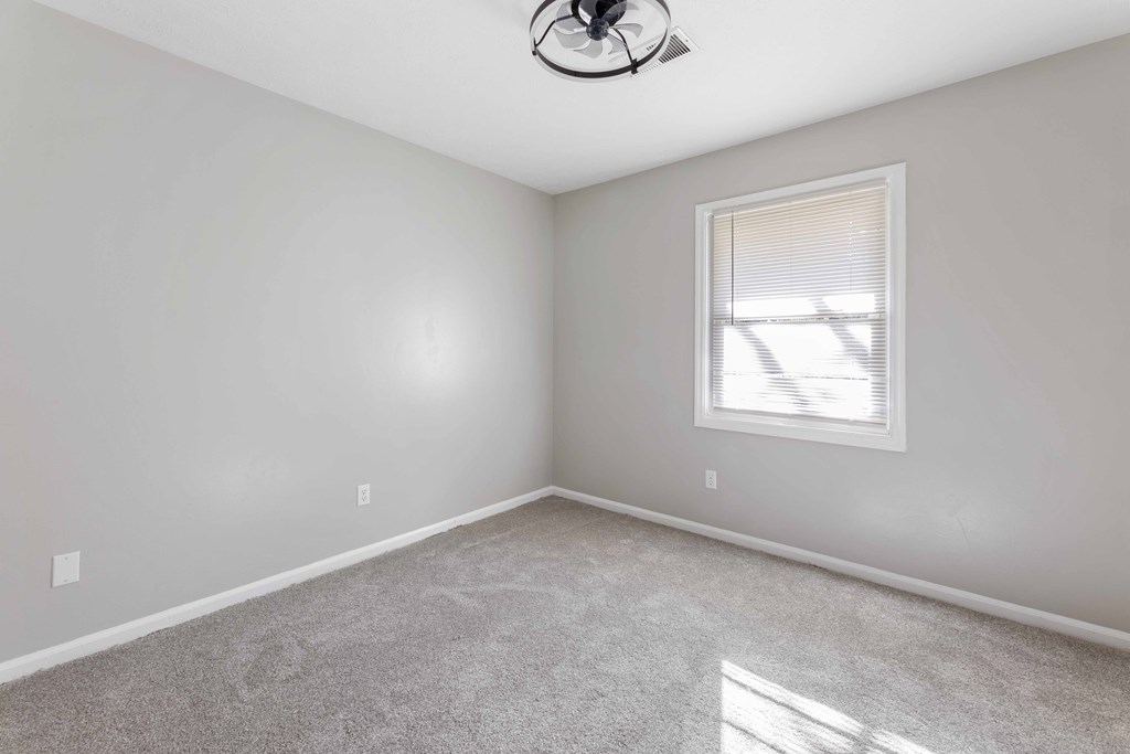 4601 Ritch Haven Road Columbus, GA 31909 - Photo 12 of 24 an empty room with windows and fan