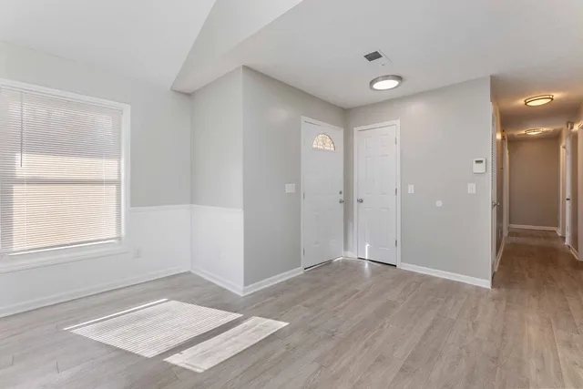 a view of an empty room and window