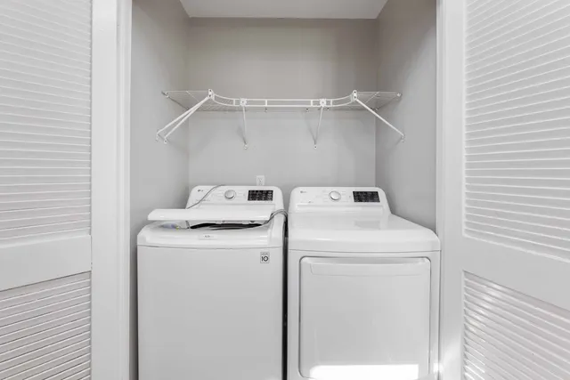 a utility room with dryer and washer