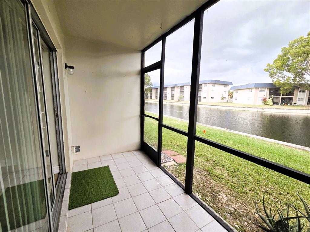 7901 South Colony Circle, Unit 101 Tamarac, FL 33321 - Photo 11 of 28 a view of a balcony with chair