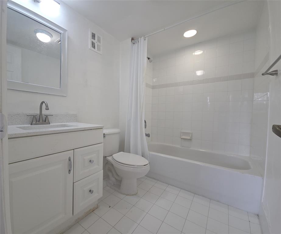 7901 South Colony Circle, Unit 101 Tamarac, FL 33321 - Photo 17 of 28 a bathroom with a sink a toilet and shower