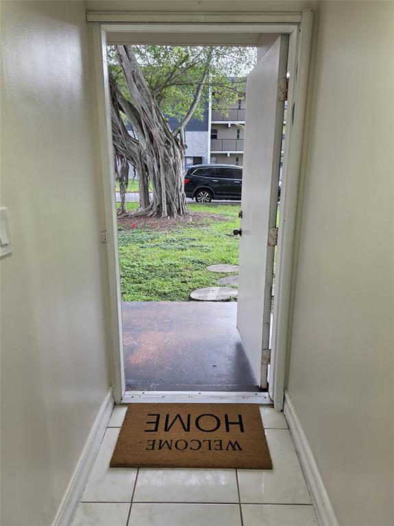 7901 South Colony Circle, Unit 101 Tamarac, FL 33321 - Photo 2 of 28 a view of a fireplace in a room