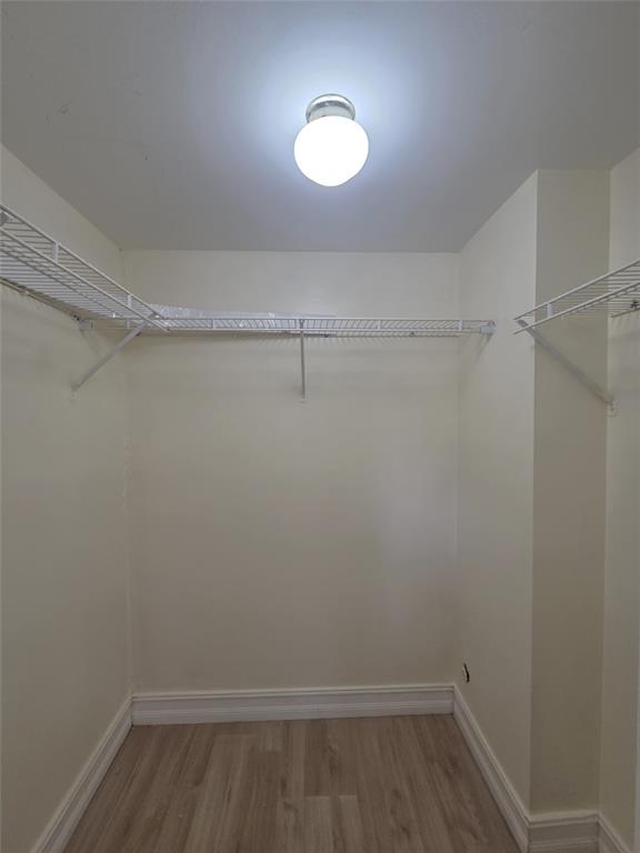 7901 South Colony Circle, Unit 101 Tamarac, FL 33321 - Photo 21 of 28 a view of an empty walk in closet