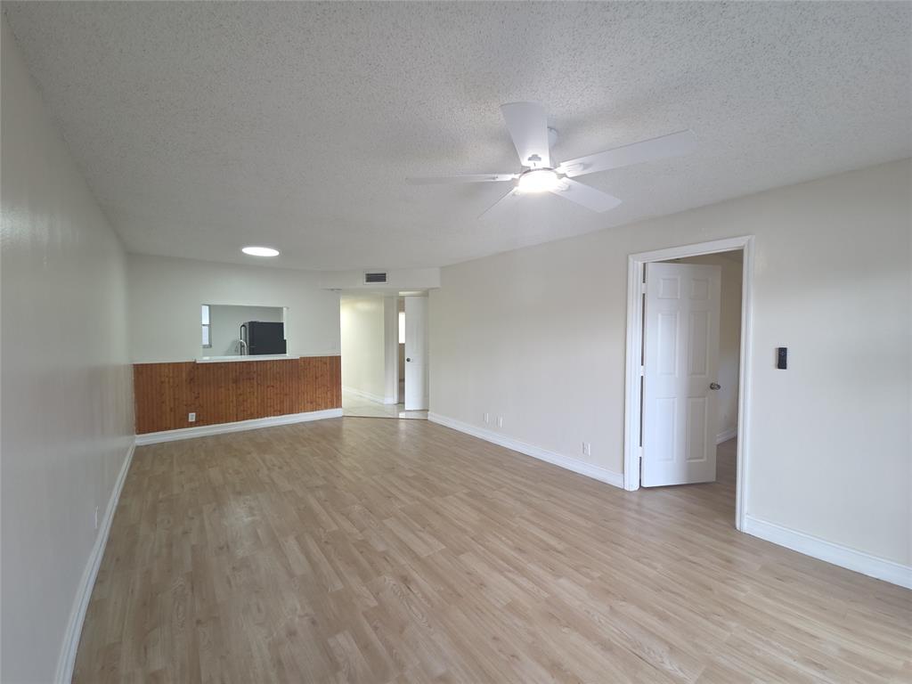 7901 South Colony Circle, Unit 101 Tamarac, FL 33321 - Photo 7 of 28 a view of empty room with wooden floor