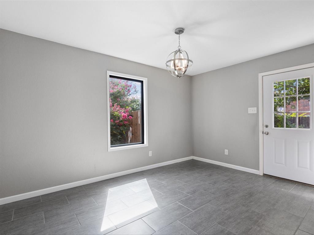 5304 Los Altos Road Fort Worth, TX 76244 - Photo 11 of 30 Spare room featuring a chandelier and baseboards