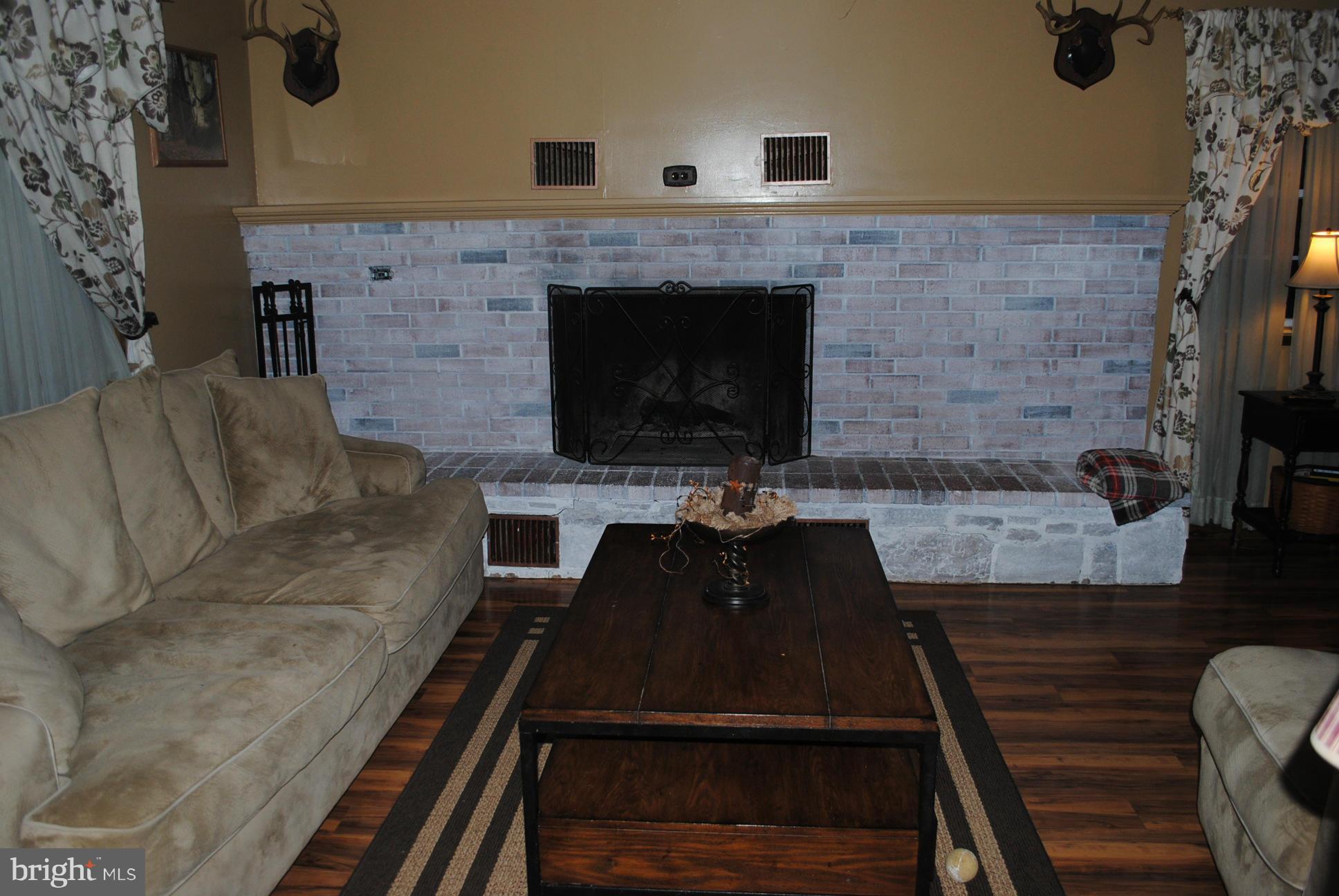 26 Messick Road Strasburg, VA 22657 - Photo 13 of 28 a living room with furniture and a fireplace
