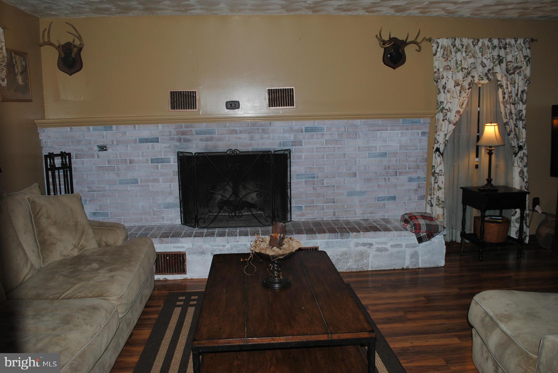 26 Messick Road Strasburg, VA 22657 - Photo 14 of 28 a living room with furniture and a fireplace