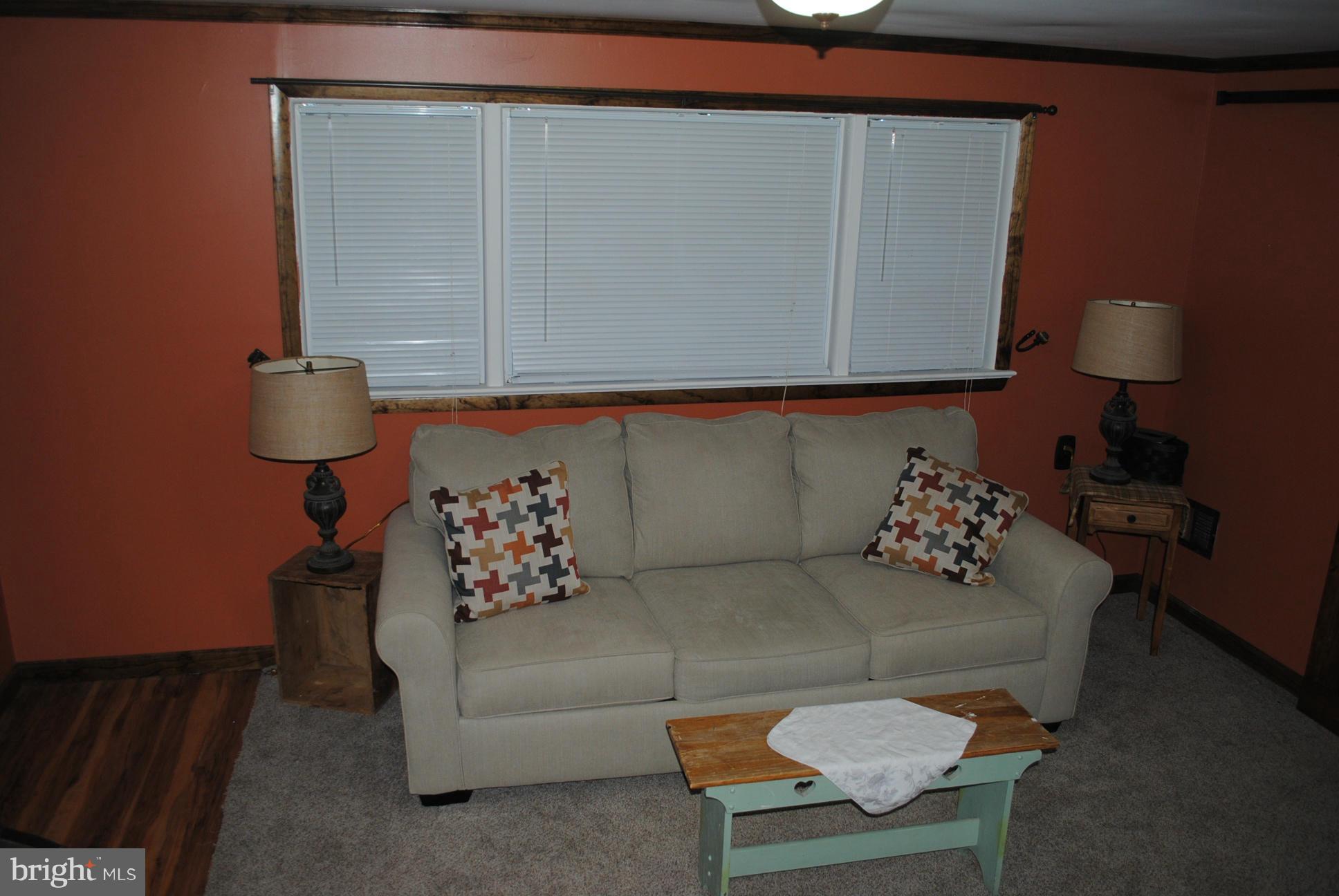26 Messick Road Strasburg, VA 22657 - Photo 15 of 28 a living room with furniture and a lamp