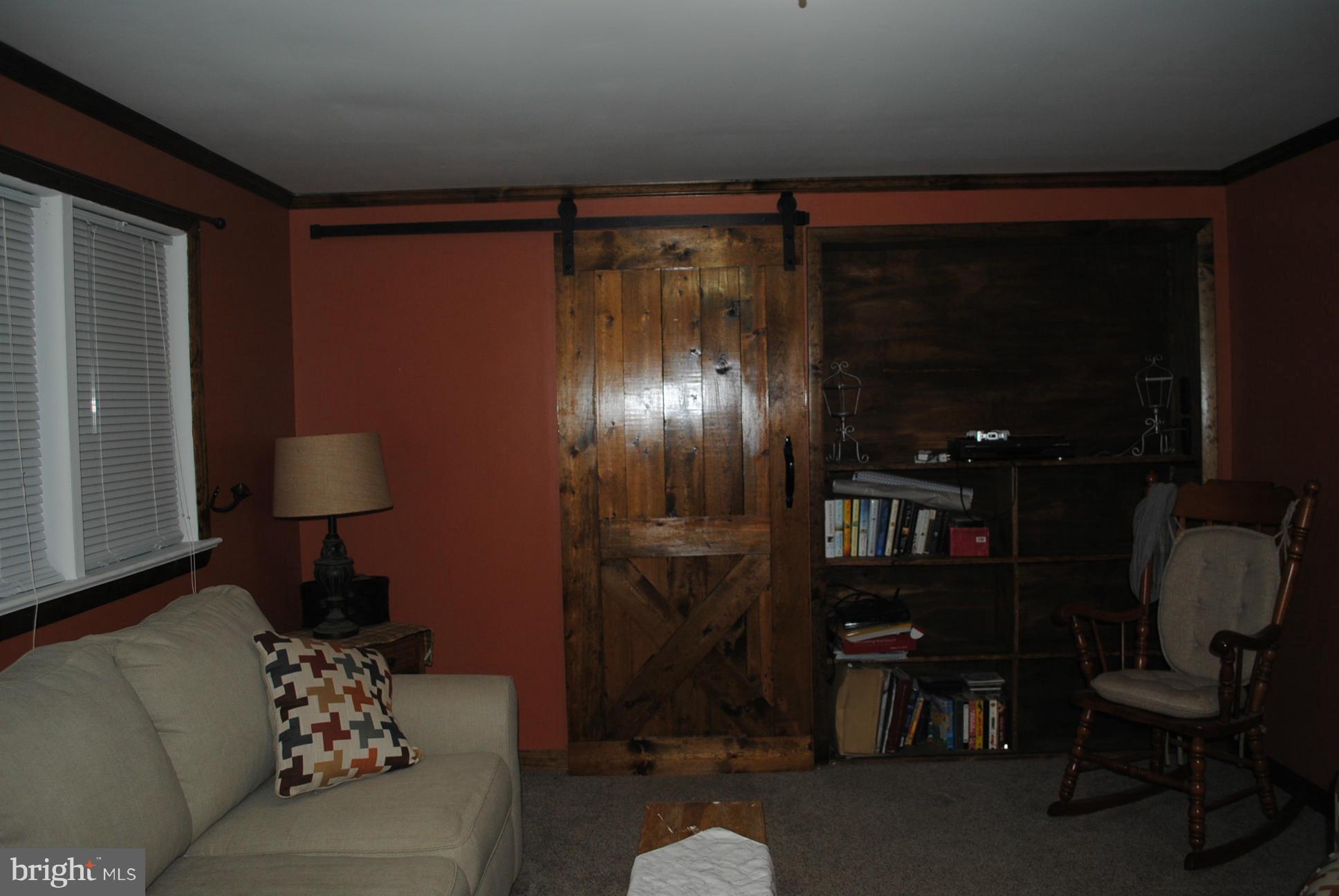 26 Messick Road Strasburg, VA 22657 - Photo 16 of 28 a room with furniture and a lamp