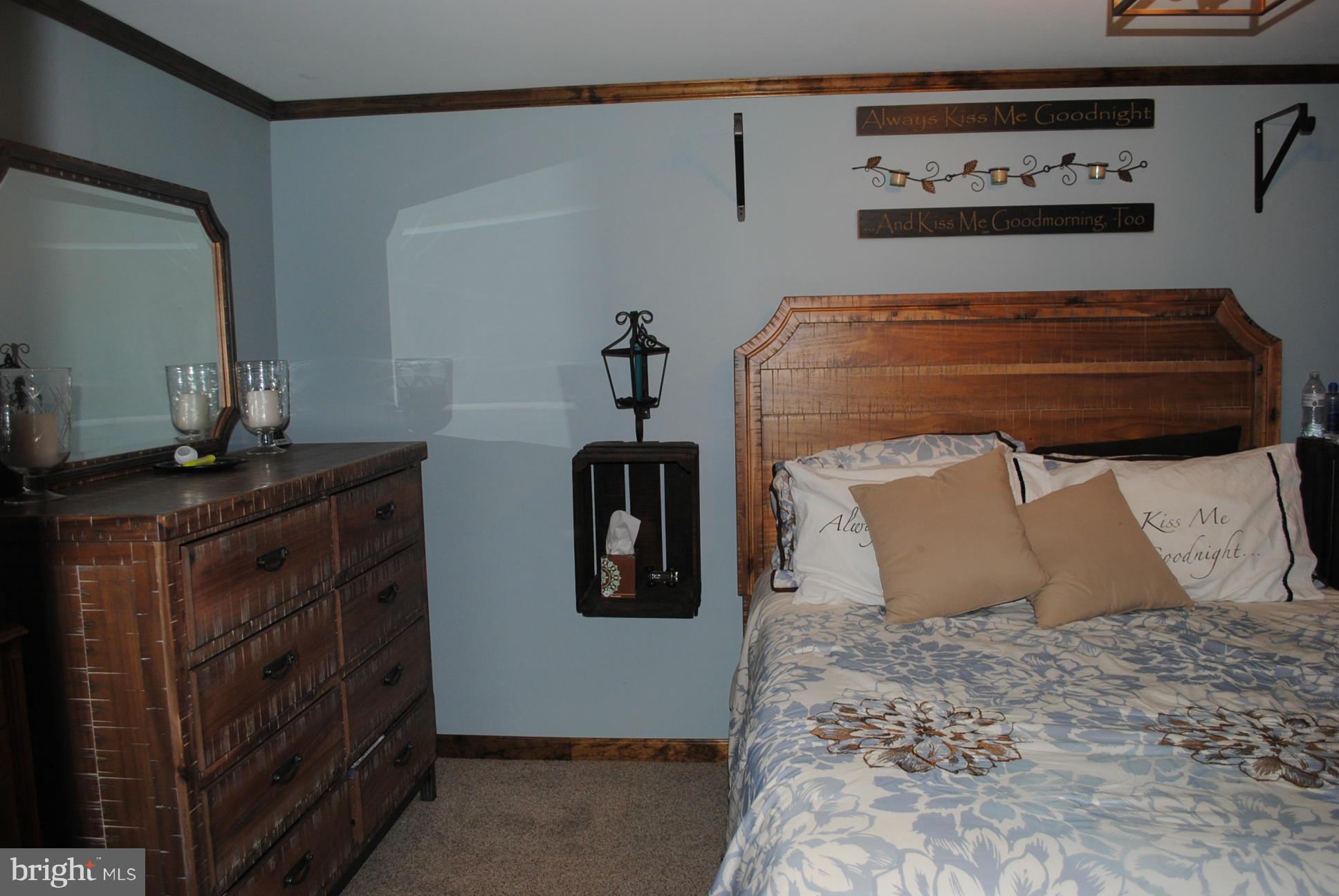 26 Messick Road Strasburg, VA 22657 - Photo 19 of 28 a room with a bed and dresser
