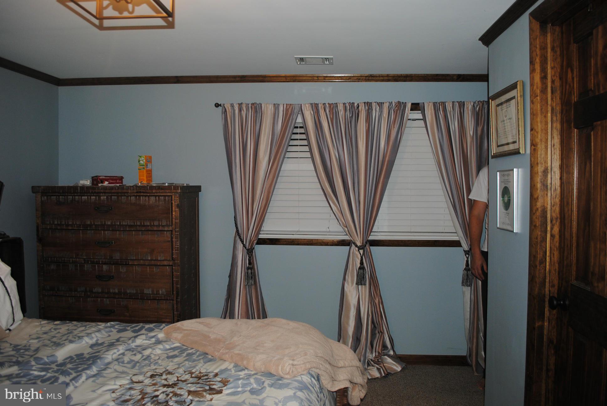 26 Messick Road Strasburg, VA 22657 - Photo 20 of 28 a bedroom with a bed and a dresser