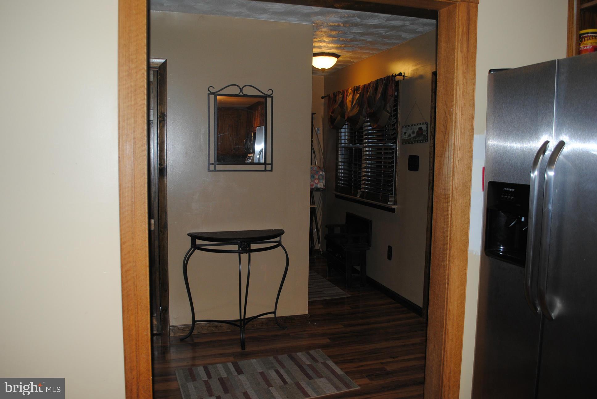 26 Messick Road Strasburg, VA 22657 - Photo 21 of 28 a view of a hallway with wooden floor and a bathroom