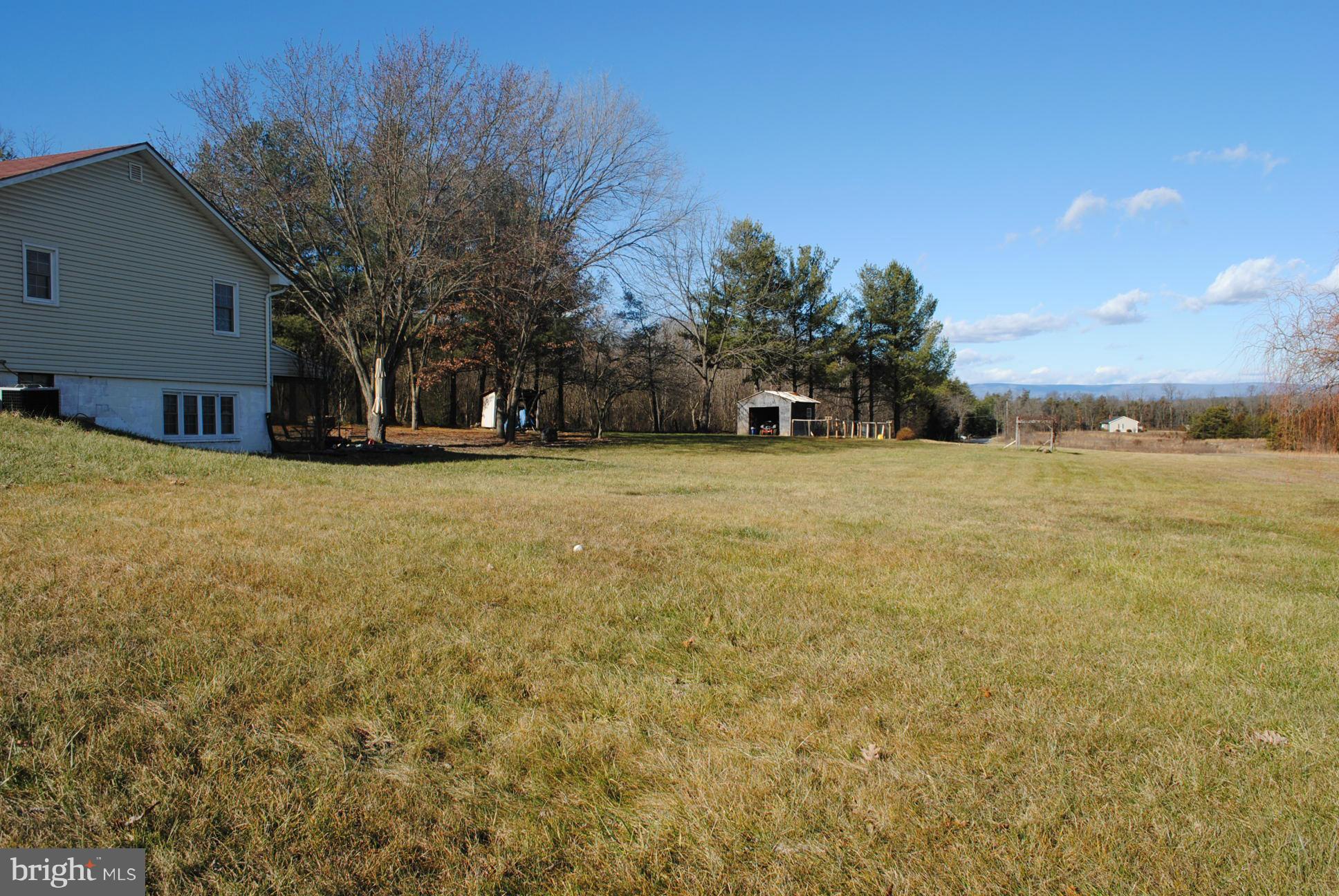 26 Messick Road Strasburg, VA 22657 - Photo 26 of 28 a view of a yard with a house in the background