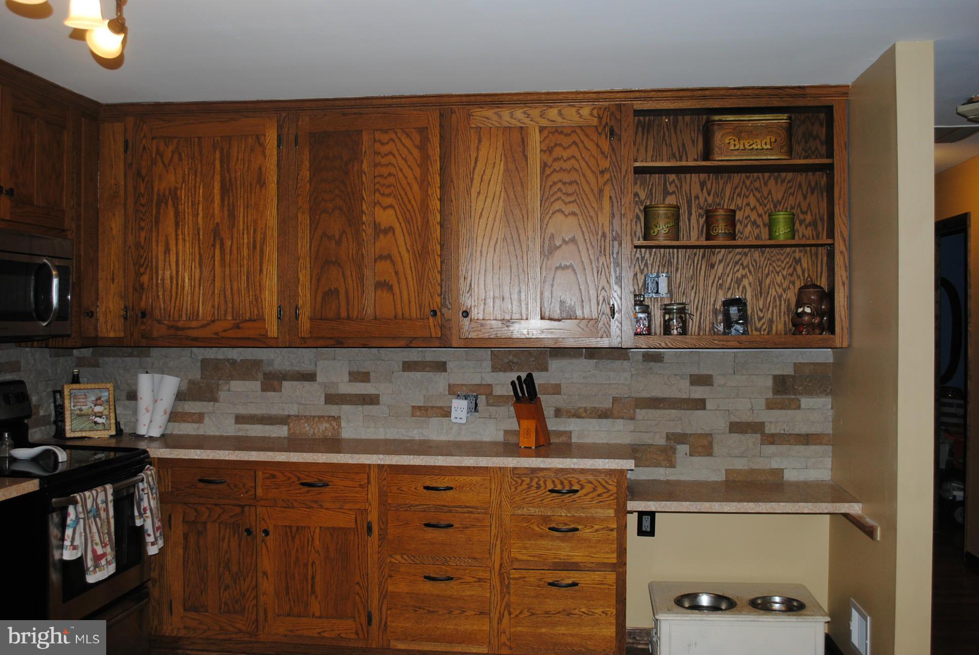 26 Messick Road Strasburg, VA 22657 - Photo 5 of 28 a kitchen with stainless steel appliances granite countertop a sink stove and cabinets