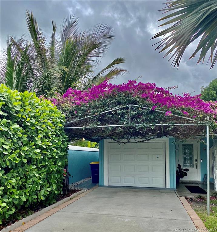 9182 Southeast Apollo Street Hobe Sound, FL 33455 - Photo 2 of 26 an outdoor space view with a potted plant