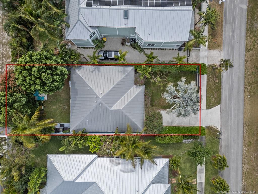 9182 Southeast Apollo Street Hobe Sound, FL 33455 - Photo 25 of 26 an aerial view of a house with a yard and garden