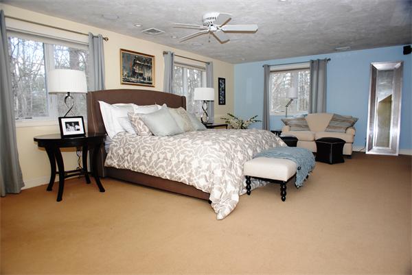 30 Austin Road Sudbury, MA 01776 - Photo 15 of 25 a bedroom with a bed couch and a window