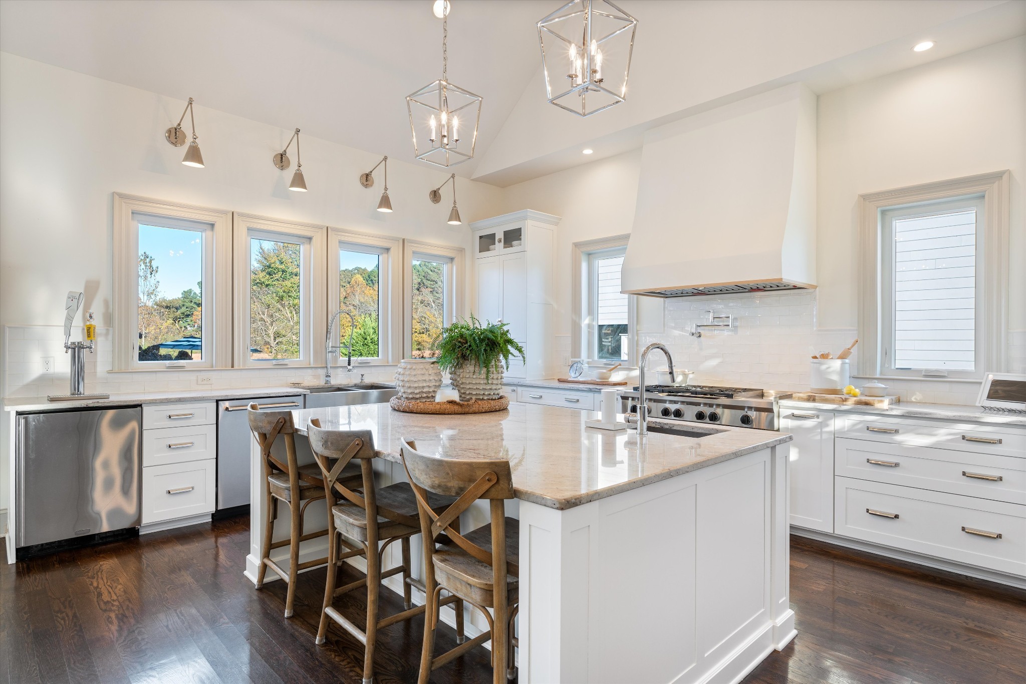 7314 Dug Hill Road Bon Aqua, TN 37025 - Photo 13 of 79 a kitchen with stainless steel appliances a stove a sink dishwasher a stove a dining table and chairs with wooden floor