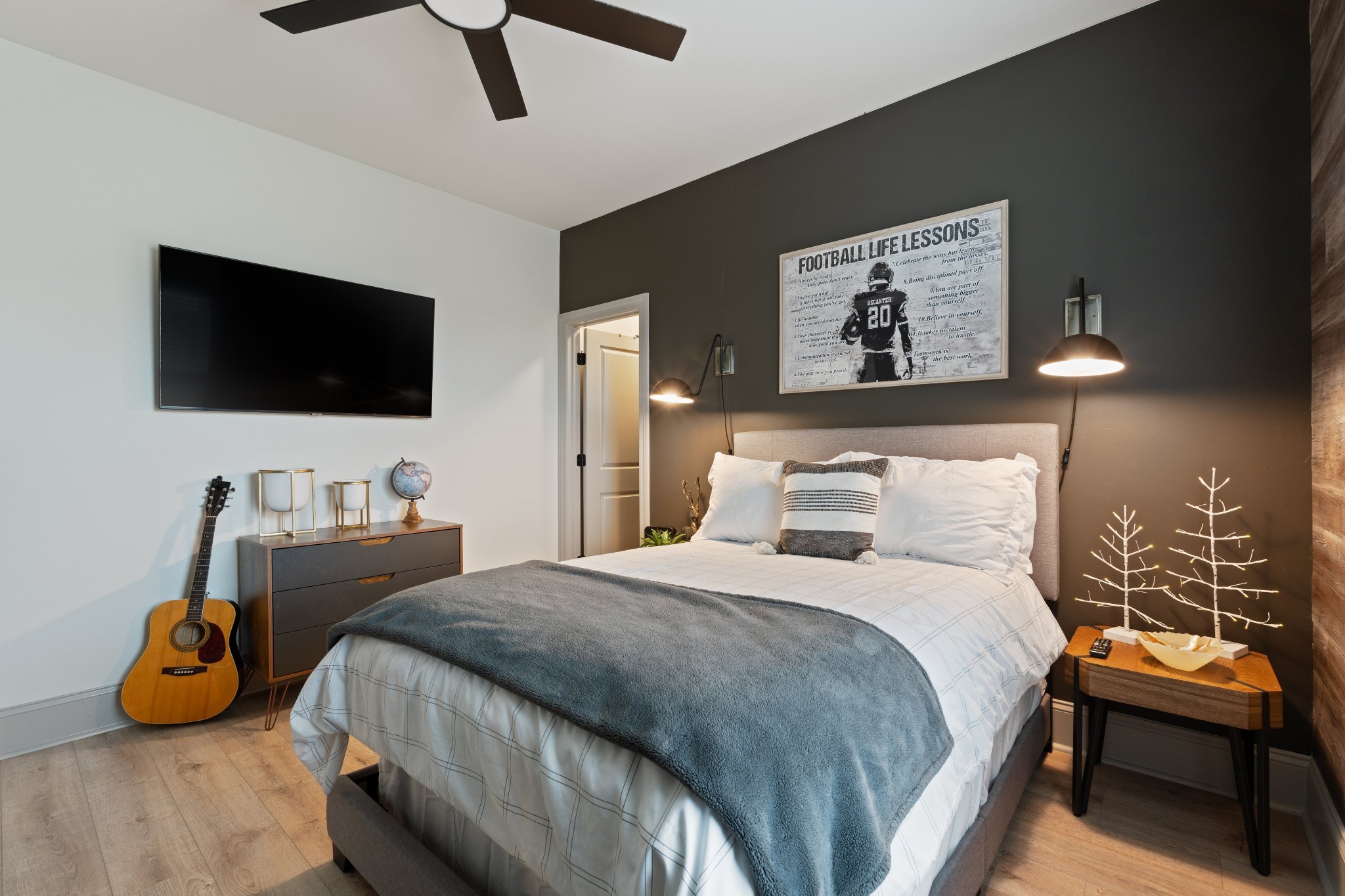 7314 Dug Hill Road Bon Aqua, TN 37025 - Photo 28 of 79 a bedroom with a bed and a flat screen tv